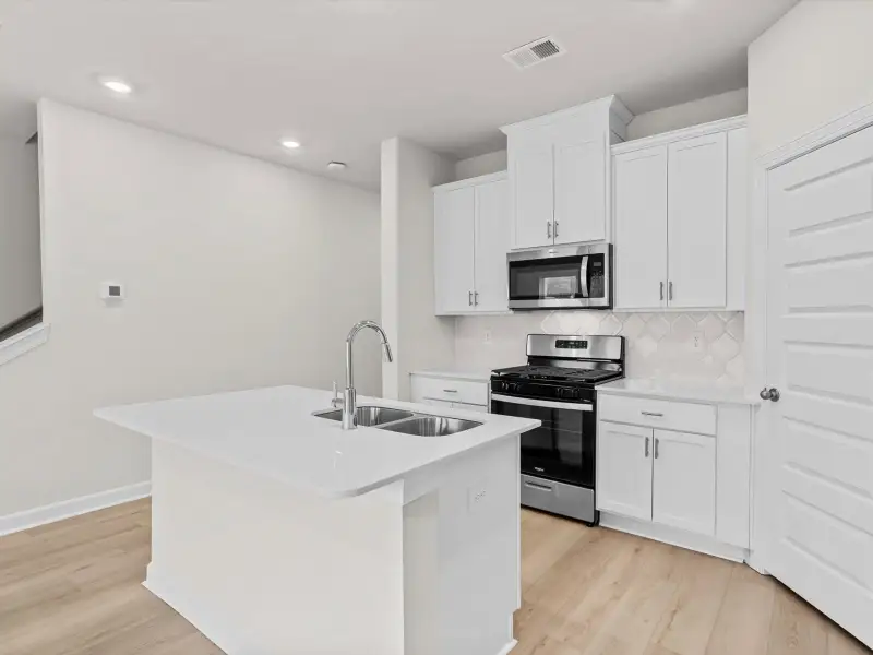 Furnished interior view inside a new home in Crossing at Abner Creek Townes, Greer (Image 4). Furnished interior view inside a new home in Crossing at Abner Creek Townes, Greer (Image 4).