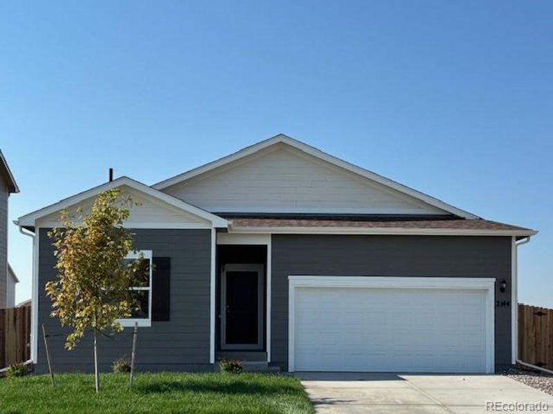 Front exterior of a new home in Cottonwood Greens, Fort Lupton, CO, highlighting curb appeal (Image 15).