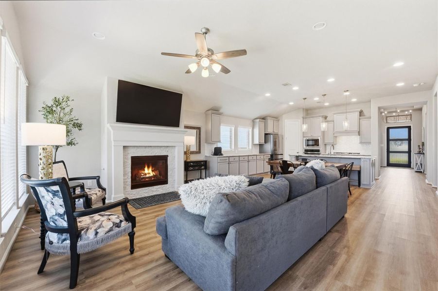 Family room with plenty of natural light and fireplace