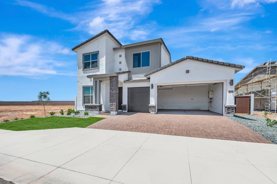 Front exterior of a new home in Alston at Soleo, San Tan Valley, AZ, highlighting curb appeal (Image 2). Front exterior of a new home in Alston at Soleo, San Tan Valley, AZ, highlighting curb appeal (Image 2).