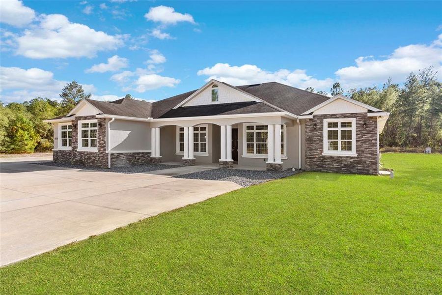 Front exterior of a new home in , Ocala, FL, highlighting curb appeal (Image 1).