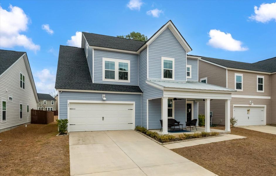 Front exterior of a new home in Limehouse Village: Arbor Series, Summerville, SC, highlighting curb appeal (Image 23). Front exterior of a new home in Limehouse Village: Arbor Series, Summerville, SC, highlighting curb appeal (Image 23).