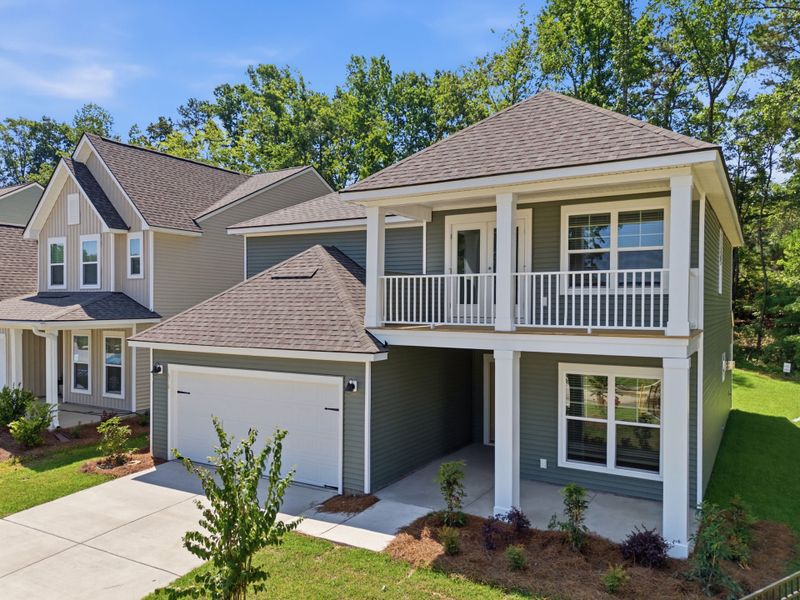 Front exterior of a new home in Grand Arbor, Blythewood, SC, highlighting curb appeal (Image 1). Front exterior of a new home in Grand Arbor, Blythewood, SC, highlighting curb appeal (Image 1).