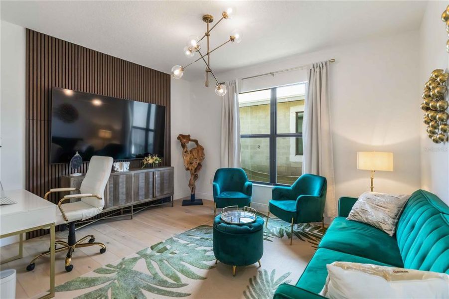 Office/Den with custom drapes, lighting and tile floor.