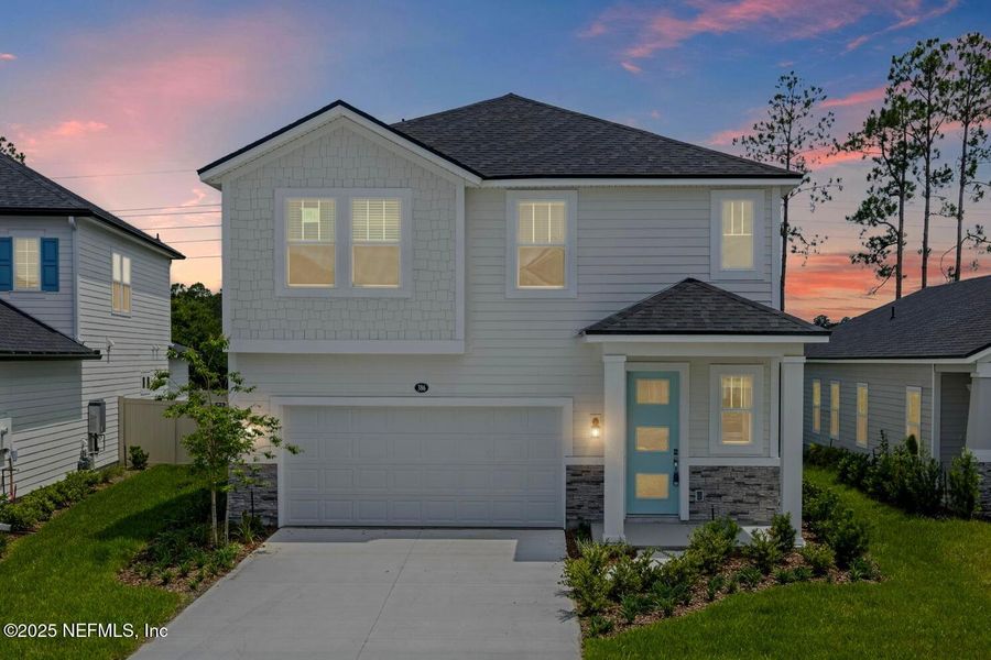 Front exterior of a new home in Beacon Lake, St. Augustine, FL, highlighting curb appeal (Image 21).