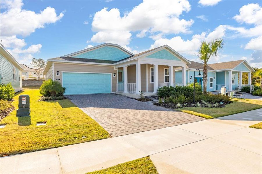 Front exterior of a new home in Green Key Village, Lady Lake, FL, highlighting curb appeal (Image 2). Front exterior of a new home in Green Key Village, Lady Lake, FL, highlighting curb appeal (Image 2).