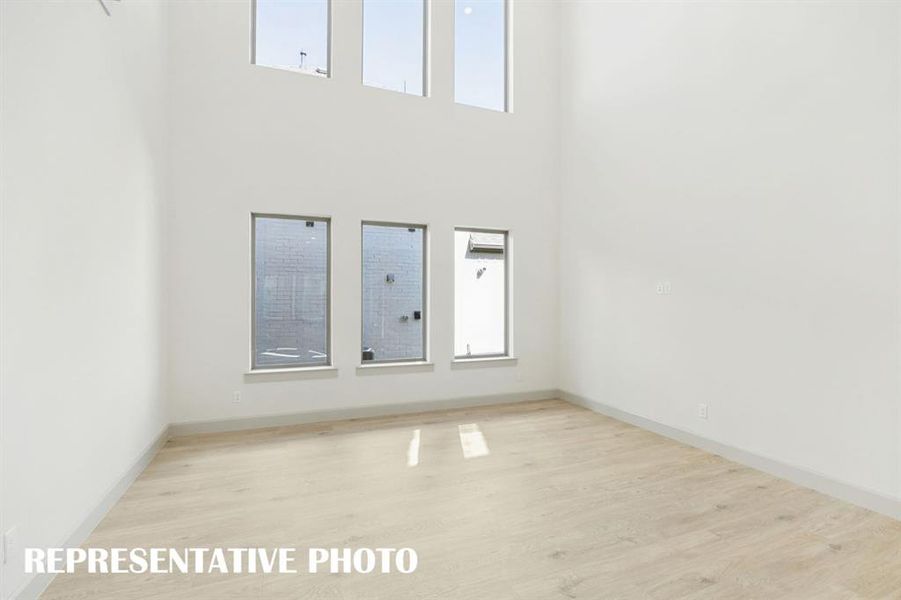 The entire family will love hosting family get togethers in this living room featuring a wall of dual stacked windows! REPRESENTATIVE PHOTO The entire family will love hosting family get togethers in this living room featuring a wall of dual stacked windows! REPRESENTATIVE PHOTO