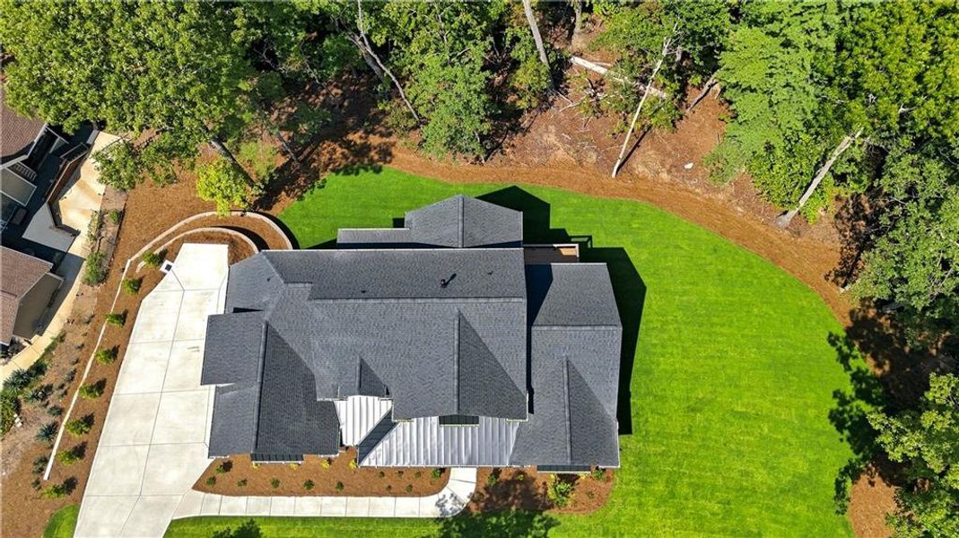 Front exterior of a new home in , Flowery Branch, GA, highlighting curb appeal (Image 24). Front exterior of a new home in , Flowery Branch, GA, highlighting curb appeal (Image 24).