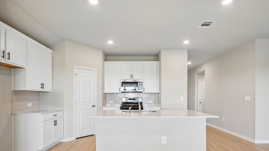 Furnished interior view inside a new home in Carillon, Manor (Image 8).