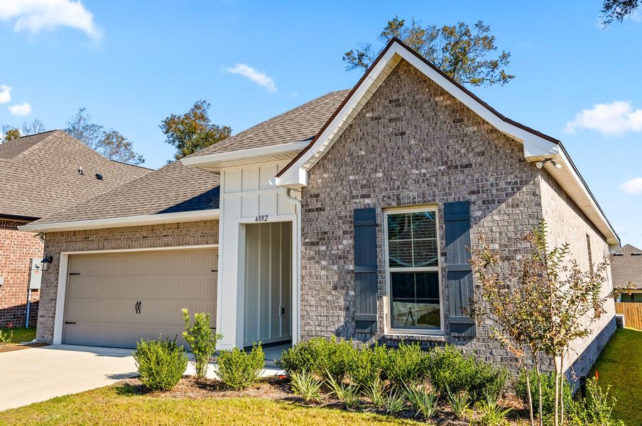 Front exterior of a new home in Sentinel Ridge, Pace, FL, highlighting curb appeal (Image 18).