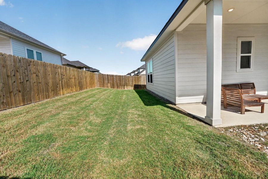 Exterior details and patio area of a home in Cascades at Onion Creek, Austin (Image 25).