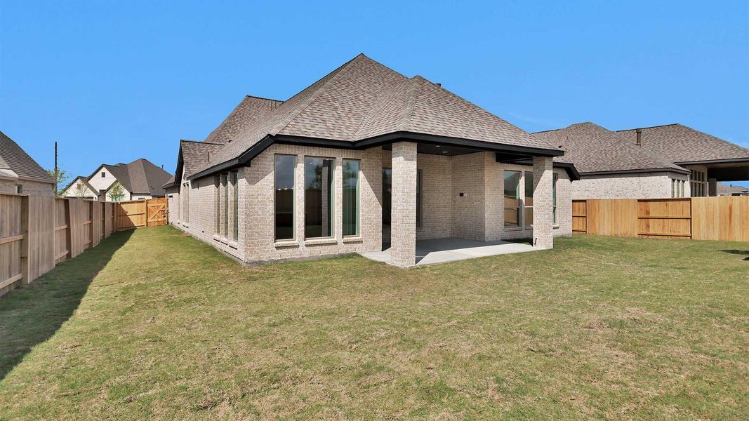 Exterior details and patio area of a home in Meridiana, Manvel (Image 4).