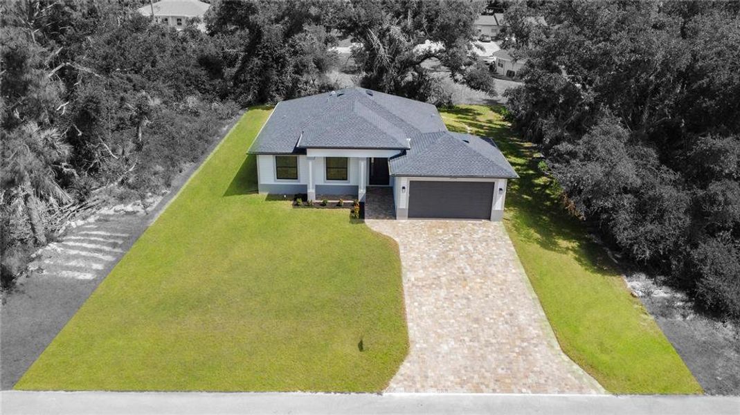 Front exterior of a new home in , Port Charlotte, FL, highlighting curb appeal (Image 1). Front exterior of a new home in , Port Charlotte, FL, highlighting curb appeal (Image 1).