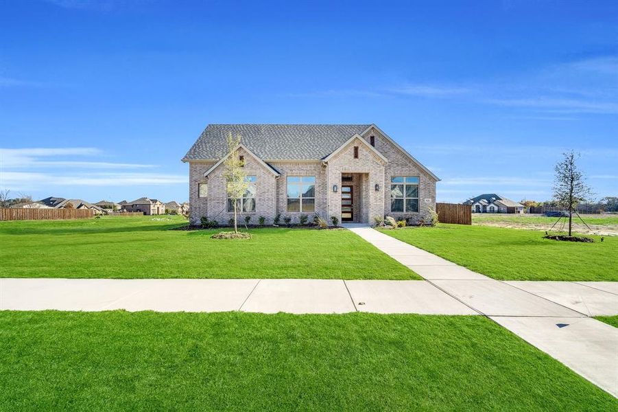 Front exterior of a new home in Ten Mile Creek Estates, DeSoto, TX, highlighting curb appeal (Image 19). Front exterior of a new home in Ten Mile Creek Estates, DeSoto, TX, highlighting curb appeal (Image 19).