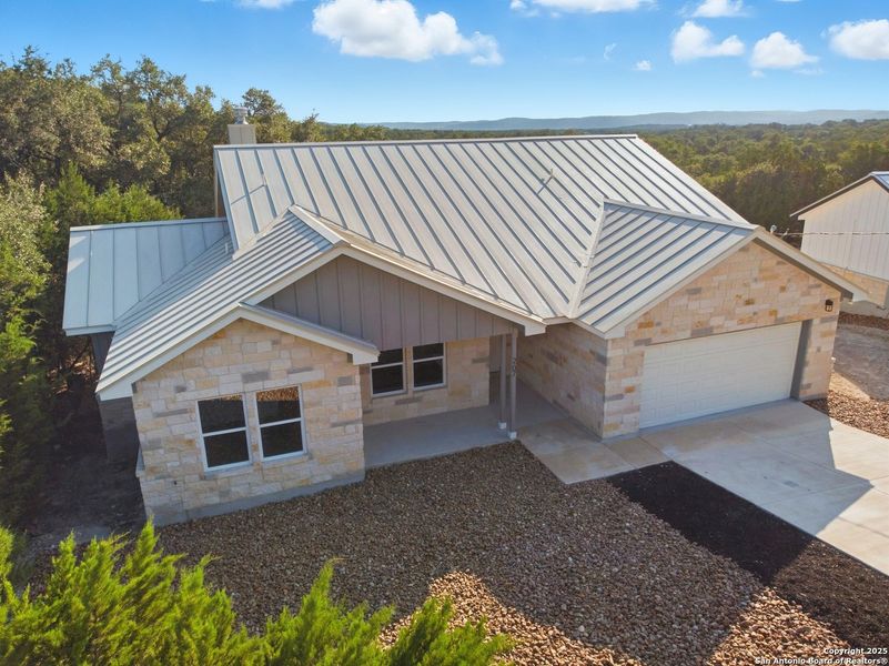 Front exterior of a new home in , Lakehills, TX, highlighting curb appeal (Image 2). Front exterior of a new home in , Lakehills, TX, highlighting curb appeal (Image 2).
