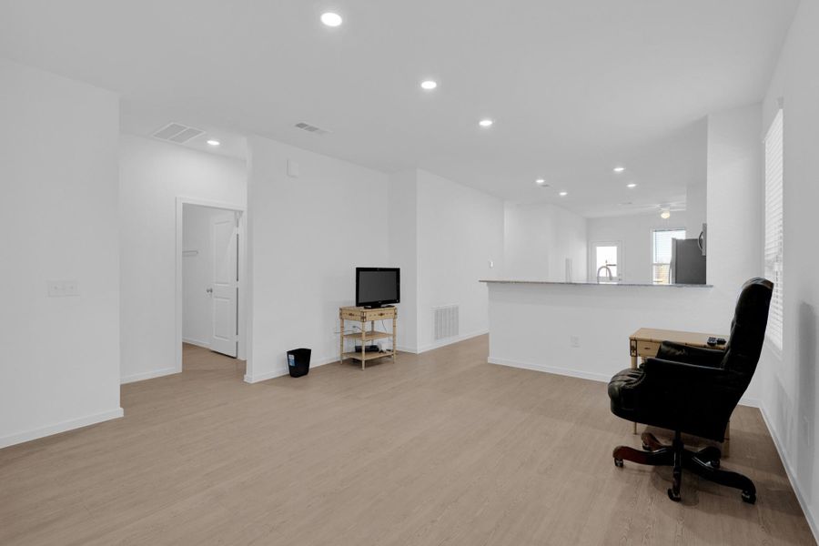 Large family room with views of kitchen/combo