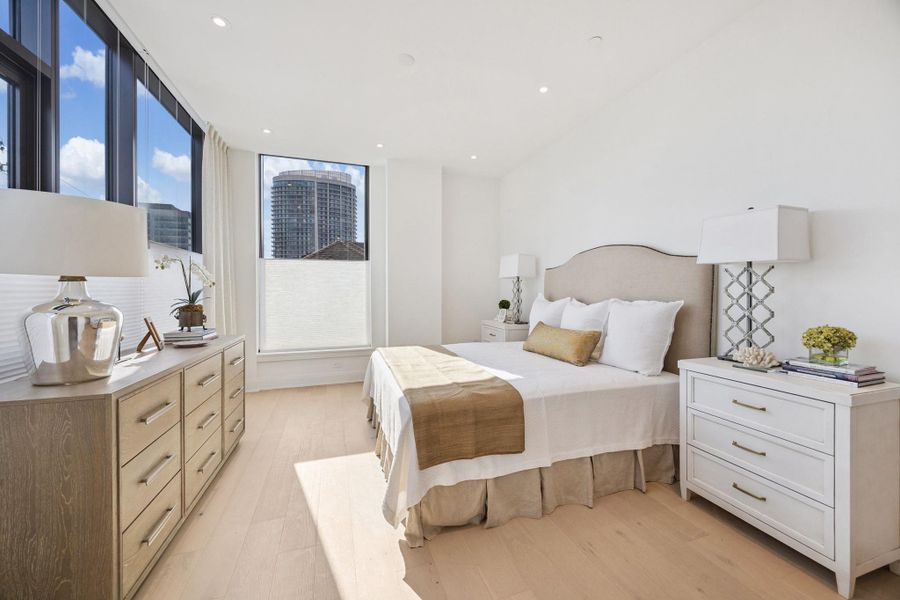 Primary bedroom also enjoys sunny views to the west as well as from the south. Shades and draperies included. Primary bedroom also enjoys sunny views to the west as well as from the south. Shades and draperies included.