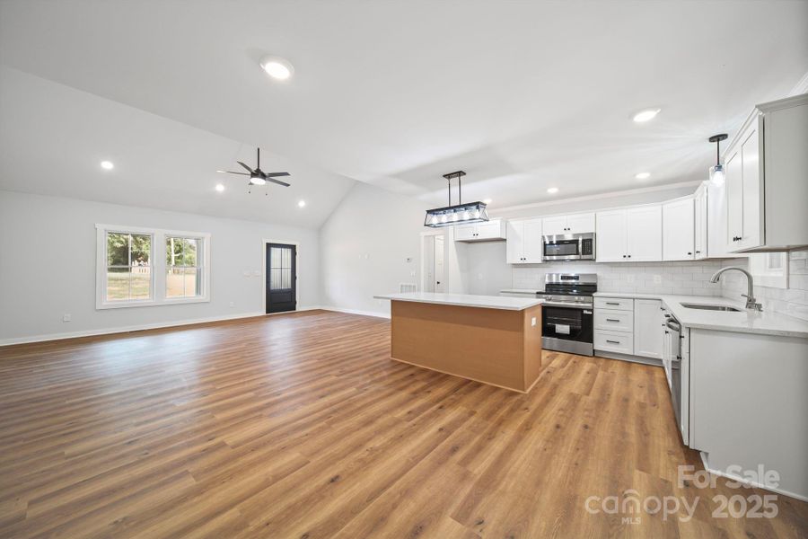 Large open floor plan with a view from dining area. Large open floor plan with a view from dining area.