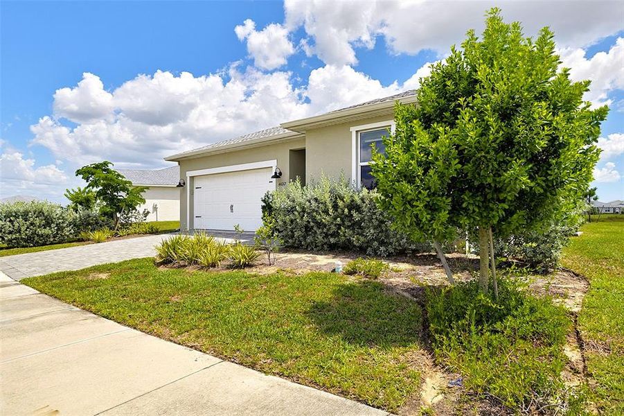 Front exterior of a new home in , Punta Gorda, FL, highlighting curb appeal (Image 2). Front exterior of a new home in , Punta Gorda, FL, highlighting curb appeal (Image 2).