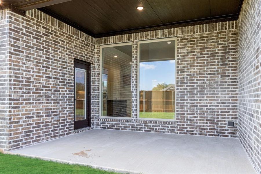 Exterior details and patio area of a home in Mockingbird Hills 60-65, Joshua (Image 25).