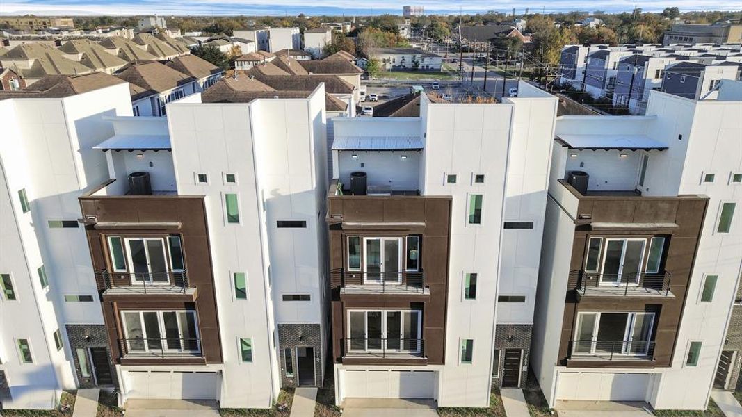 Front view of this beautiful 4 story modern contemporary home with a rooftop deck!