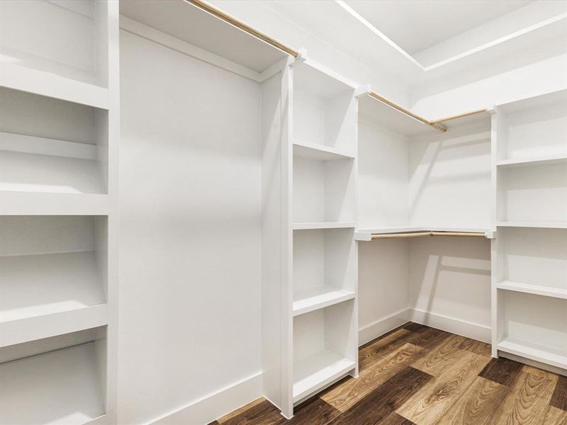 Walk in closet featuring wood finished floors