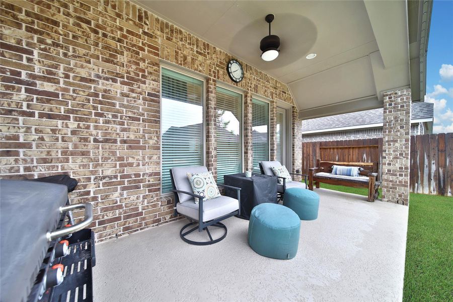Enjoy outdoor living on the covered patio, already equipped with a TV hookup & plumbed for gas—perfect outdoor entertaining.