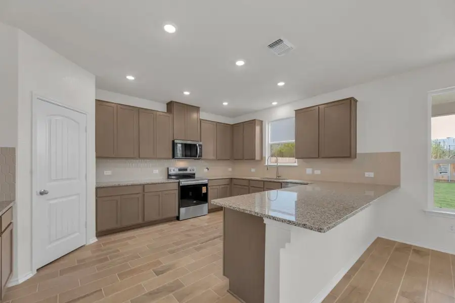 Furnished interior view inside a new home in Mustang Valley, Manor (Image 7).