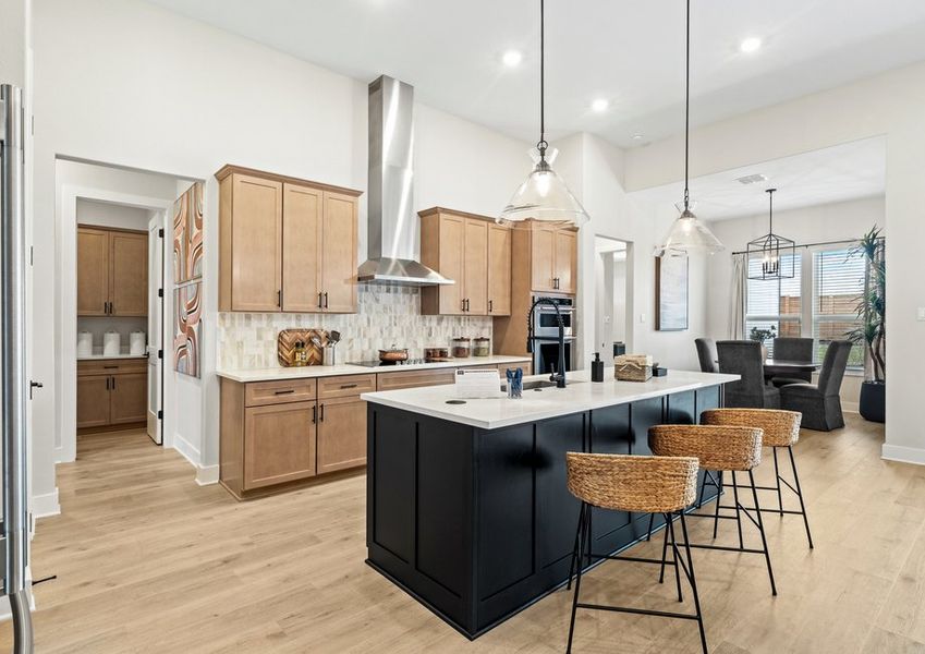 The kitchen has beautiful designer cabinetry.