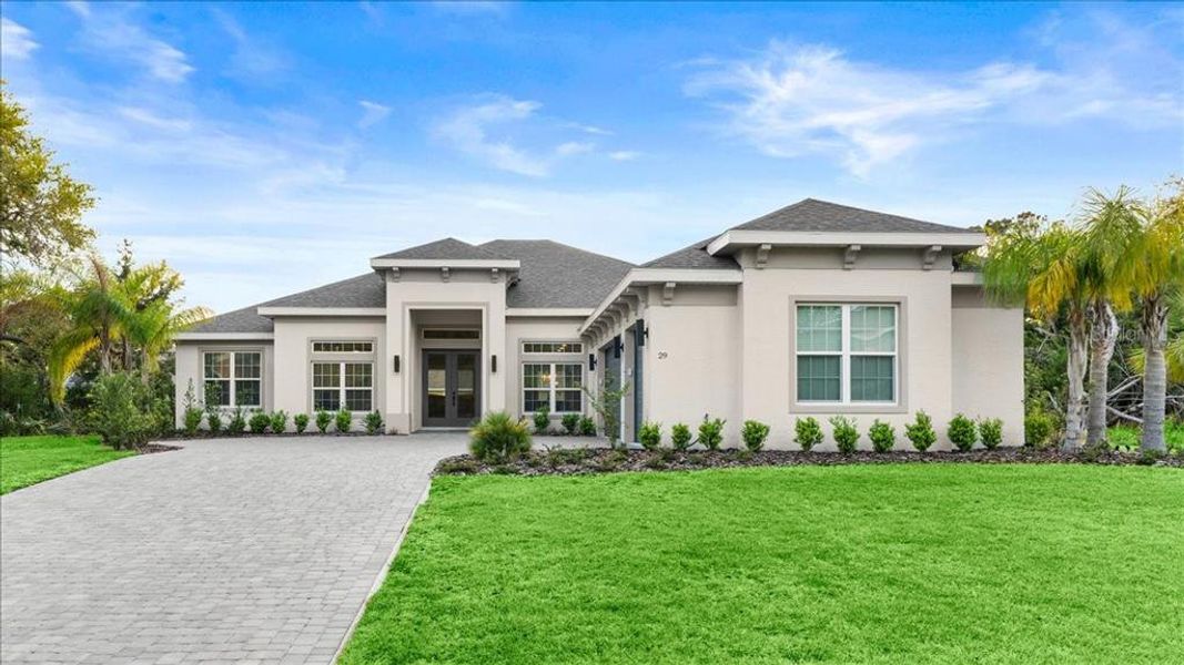 Front exterior of a new home in , Palm Coast, FL, highlighting curb appeal (Image 1).