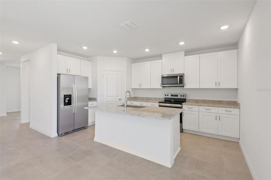 Furnished interior view inside a new home in Hilltop Vistas, Dade City (Image 14).