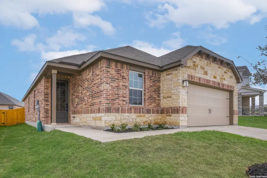 Front exterior of a new home in Hightop Ridge, Converse, TX, highlighting curb appeal (Image 2). Front exterior of a new home in Hightop Ridge, Converse, TX, highlighting curb appeal (Image 2).