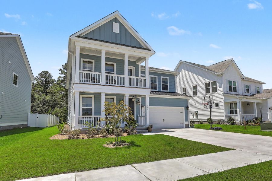 Front exterior of a new home in Tidewater at Lakes of Cane Bay, Summerville, SC, highlighting curb appeal (Image 20). Front exterior of a new home in Tidewater at Lakes of Cane Bay, Summerville, SC, highlighting curb appeal (Image 20).