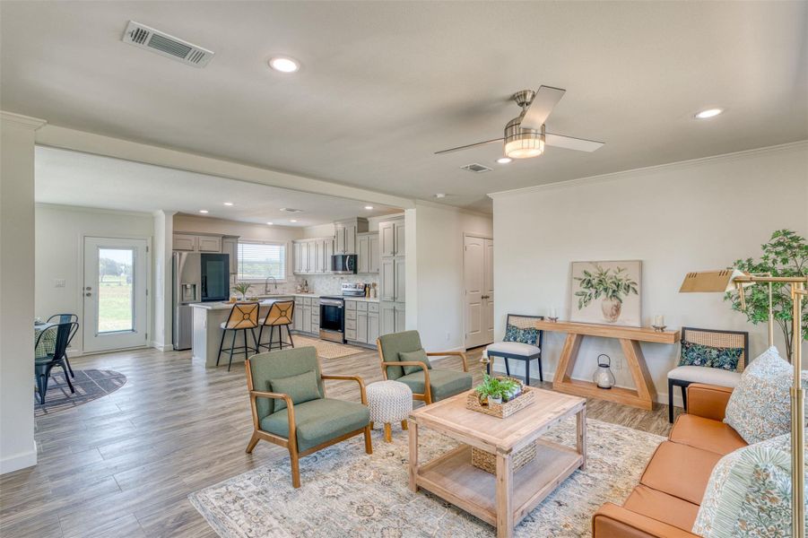An open floorplan seamlessly connects the living area to a well-appointed kitchen. An open floorplan seamlessly connects the living area to a well-appointed kitchen.