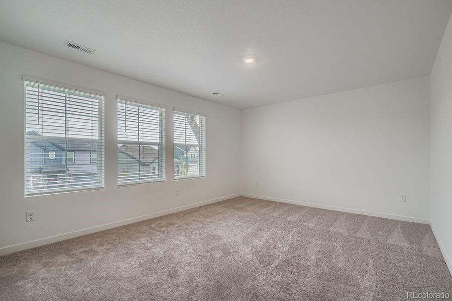 Spacious, unfurnished interior of a new home in Eastcreek Farm: The Camden Collection, Thornton (Image 7).