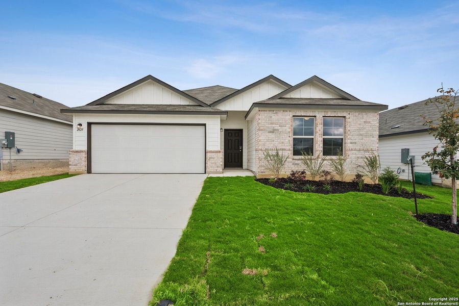 Front exterior of a new home in Greenspoint Heights, Seguin, TX, highlighting curb appeal (Image 18).