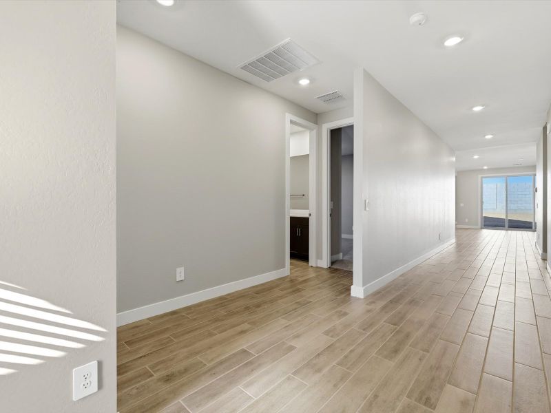 Spacious, unfurnished interior of a new home in White Tank Foothills Signature Series, Waddell (Image 12).