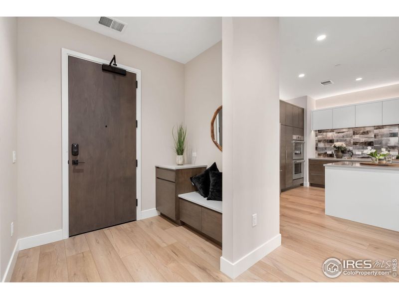 A functional entryway provides a drop zone and very large entry closet.