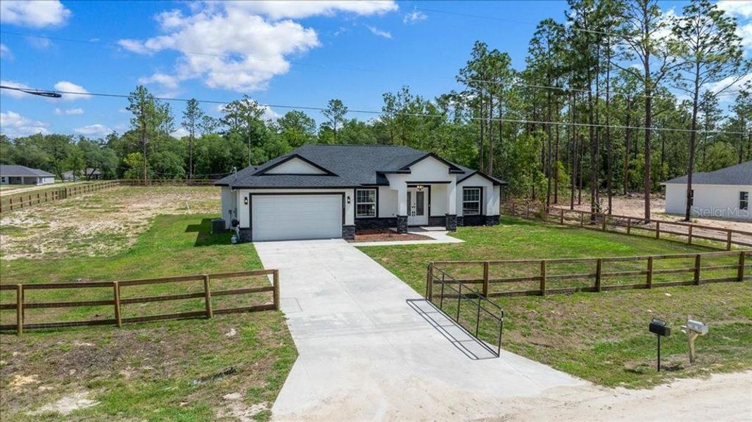 Front exterior of a new home in , Dunnellon, FL, highlighting curb appeal (Image 28). Front exterior of a new home in , Dunnellon, FL, highlighting curb appeal (Image 28).