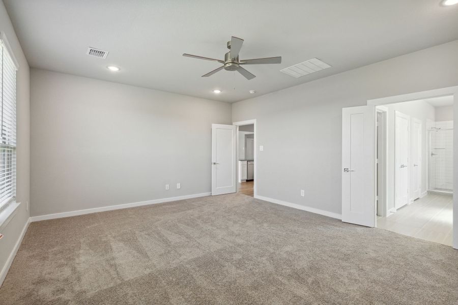 Primary Suite in the Henley home plan by Trophy Signature Homes – REPRESENTATIVE PHOTO Primary Suite in the Henley home plan by Trophy Signature Homes – REPRESENTATIVE PHOTO