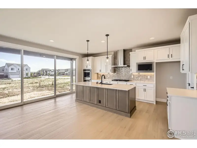 Furnished interior view inside a new home in RainDance, Windsor (Image 8).