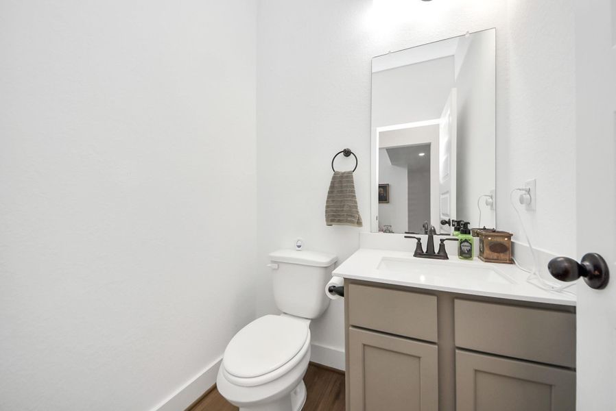 Bright, stylish half bath conveniently located on the main floor.