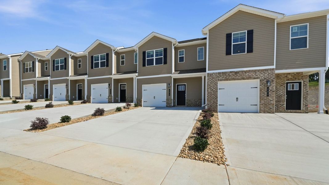 Front exterior of a new home in Cherokee Crossing, Kodak, TN, highlighting curb appeal (Image 2). Front exterior of a new home in Cherokee Crossing, Kodak, TN, highlighting curb appeal (Image 2).