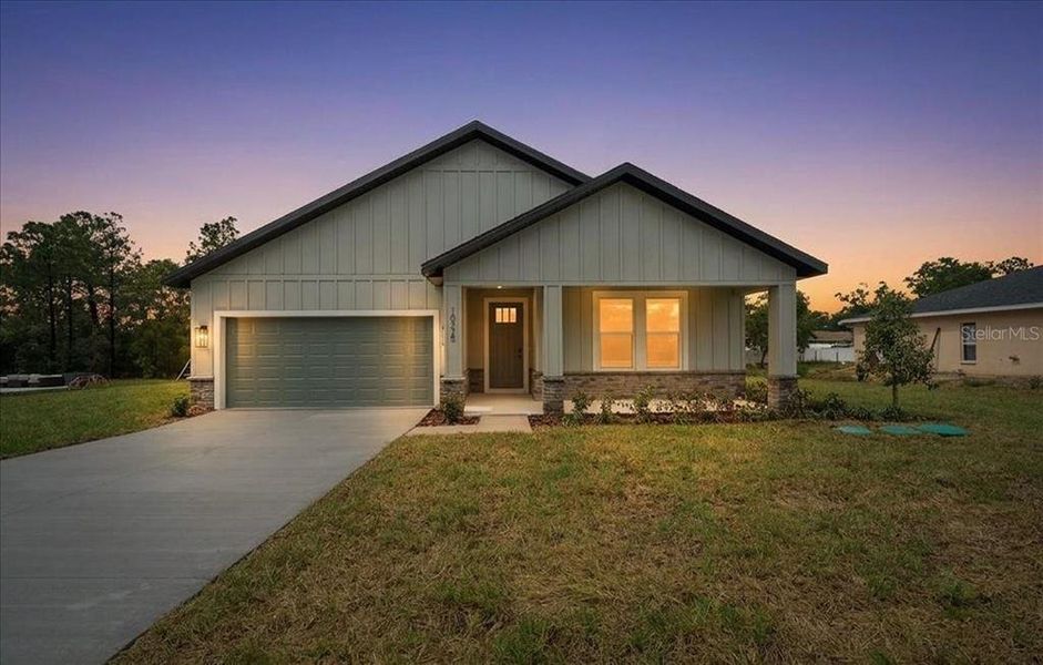 Front exterior of a new home in , Weeki Wachee, FL, highlighting curb appeal (Image 31). Front exterior of a new home in , Weeki Wachee, FL, highlighting curb appeal (Image 31).