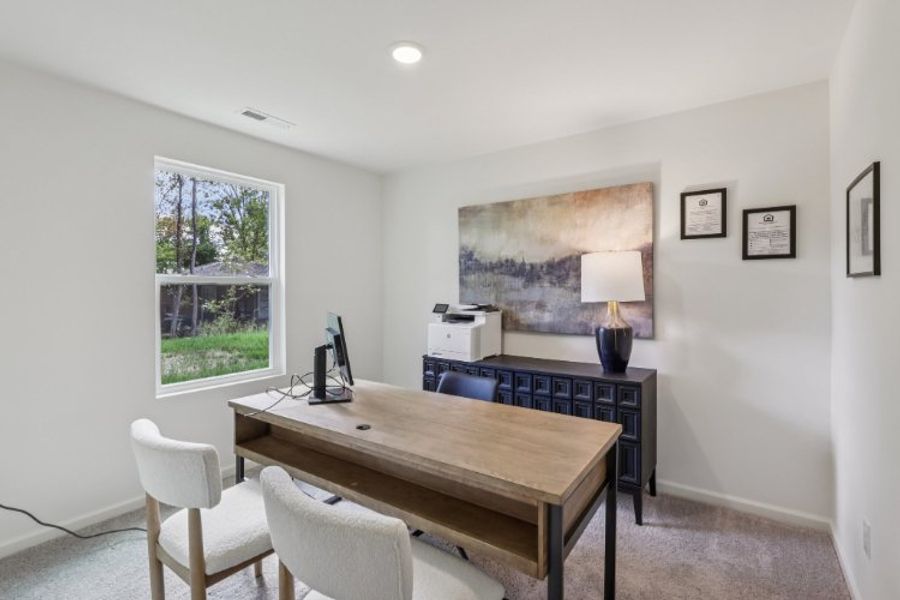 A room with a desk and chairs. A room with a desk and chairs.