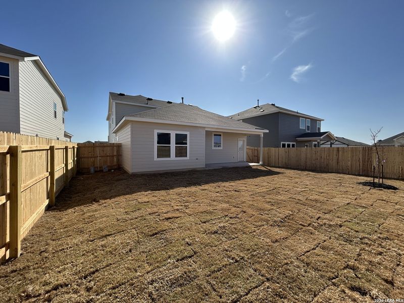 Exterior details and patio area of a home in Hennersby Hollow, San Antonio (Image 4).