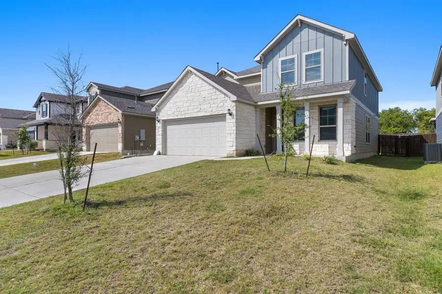 Front exterior of a new home in Carlson Place, Georgetown, TX, highlighting curb appeal (Image 18).