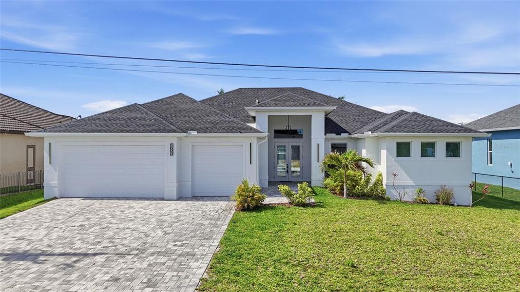 Front exterior of a new home in , Cape Coral, FL, highlighting curb appeal (Image 25).