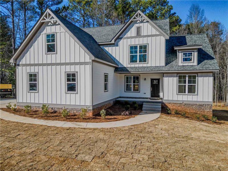 Front exterior of a new home in , Villa Rica, GA, highlighting curb appeal (Image 2). Front exterior of a new home in , Villa Rica, GA, highlighting curb appeal (Image 2).