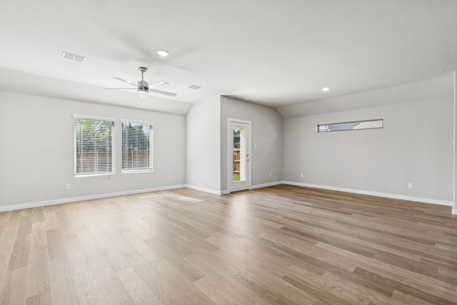 Dining and Living Room in the Heisman home plan by Trophy Signature Homes – REPRESENTATIVE PHOTO Dining and Living Room in the Heisman home plan by Trophy Signature Homes – REPRESENTATIVE PHOTO